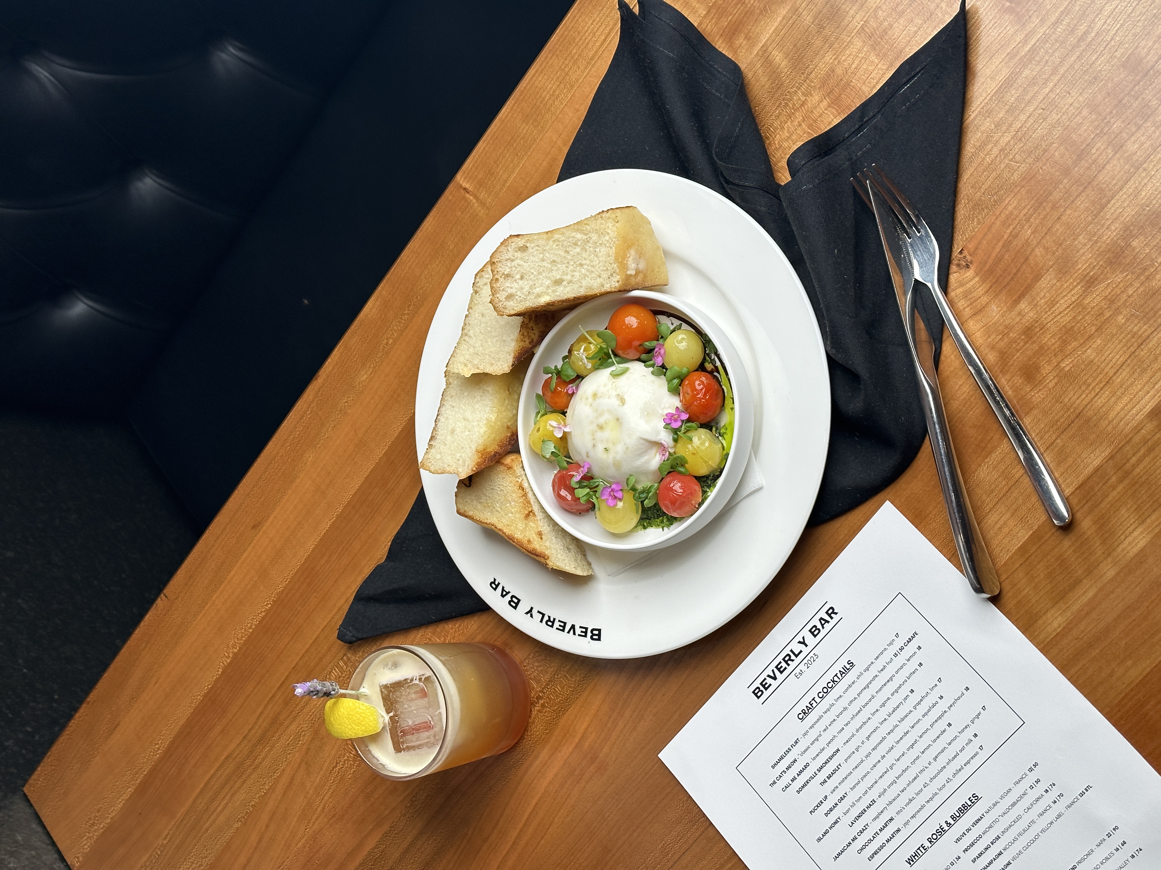Burrata with heirloom tomatoes and toast points — Beverly Bar starter
